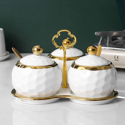 Sleek white and gold ceramic canisters