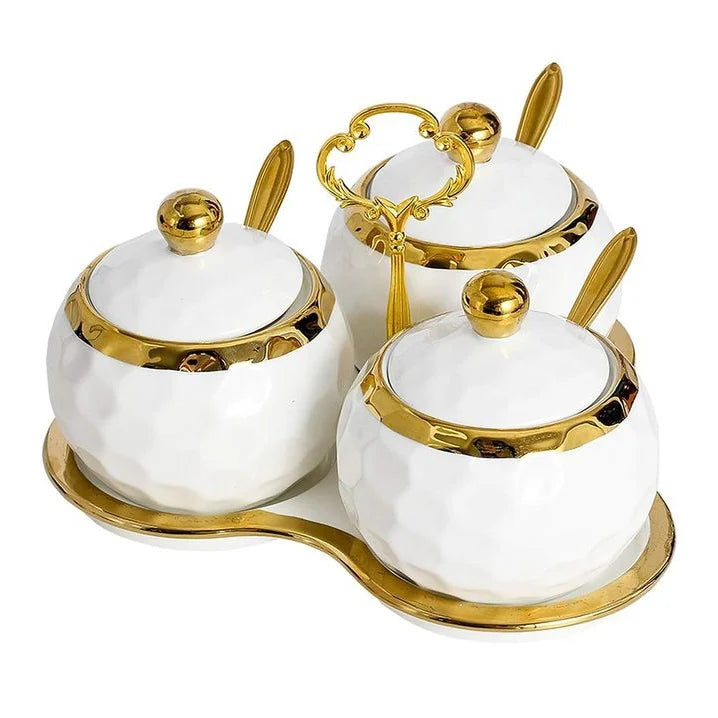 Sleek white and gold ceramic canisters